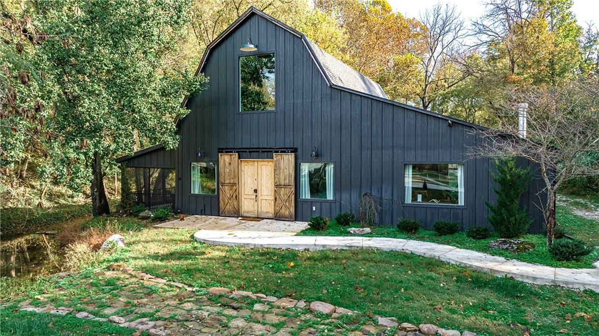 The Barn at the StayInnOZ basecamp — designer barndominium with trailside character in Bentonville, Arkansas